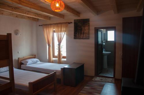Кровать или кровати в номере Aste Guesthouse