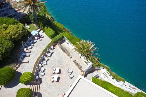 an overhead view of a beach with palm trees and the ocean at Seth Agamenon in Es Castell