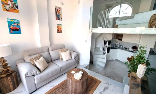 a living room with a couch and a table at New beachfront duplex - sleeps up to 4 in Gibraltar