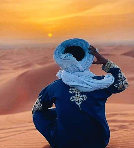 a painting of a person in the desert at Khadija Desert Camp in Merzouga