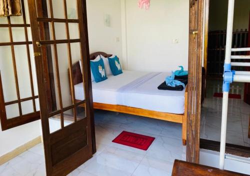 Postel nebo postele na pokoji v ubytování Daban Homestay Ella