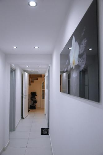 a hallway with a picture of a flower on the wall at Villa Nena in Makarska
