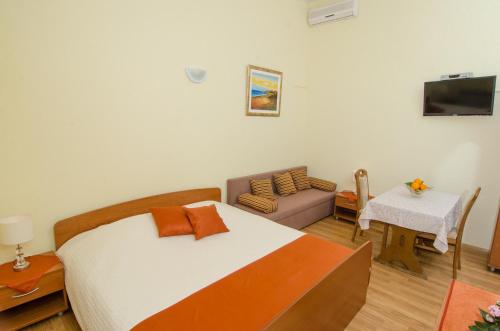 Ένα ή περισσότερα κρεβάτια σε δωμάτιο στο Bed & Breakfast Villa Vrgorac