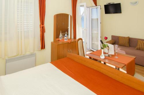 Ένα ή περισσότερα κρεβάτια σε δωμάτιο στο Bed & Breakfast Villa Vrgorac