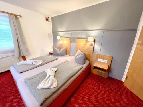Katil atau katil-katil dalam bilik di BnB Fliegerhaeusle Hagnau 24h Self Check In