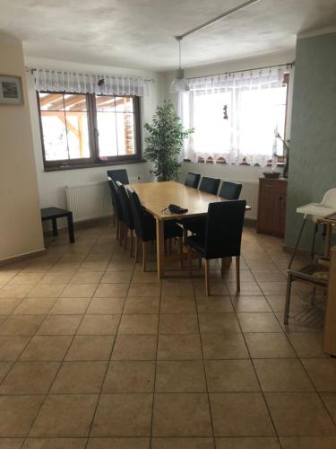 a dining room with a table and chairs at Villapark apartments 201, Lipno in Lipno nad Vltavou