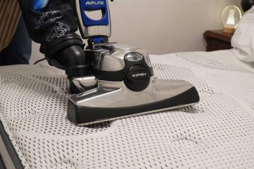 a hand mixer sitting on top of a bed at Stay Hwangchon in Gyeongju
