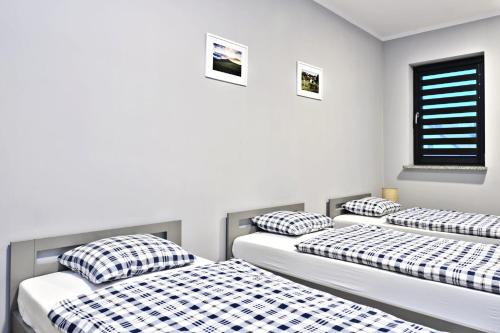 Кровать или кровати в номере Villa Krotoszyce