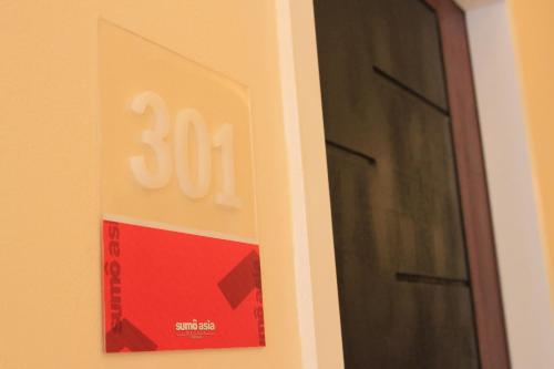 a sign on a door with a number on it at Sumo Asia Hotels - Davao in Davao City