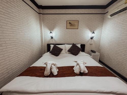 Ένα ή περισσότερα κρεβάτια σε δωμάτιο στο Hotel De Khuvieng