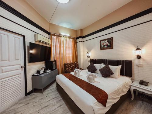 Ένα ή περισσότερα κρεβάτια σε δωμάτιο στο Hotel De Khuvieng