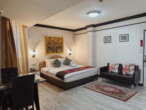 Ένα ή περισσότερα κρεβάτια σε δωμάτιο στο Hotel De Khuvieng