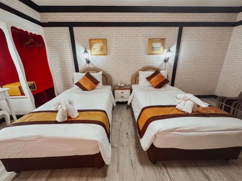 Ένα ή περισσότερα κρεβάτια σε δωμάτιο στο Hotel De Khuvieng