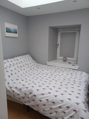 Una cama o camas en una habitación de The Toolshed