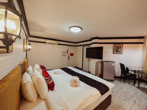 Ένα ή περισσότερα κρεβάτια σε δωμάτιο στο Hotel De Khuvieng