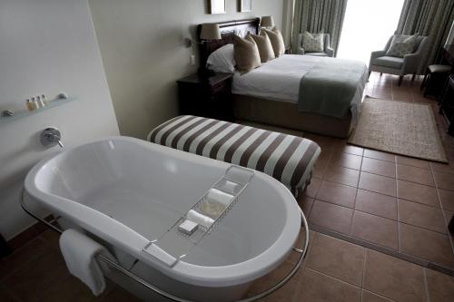 Postel nebo postele na pokoji v ubytování Hotel Cardoso
