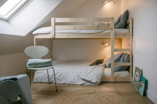 Posteľ alebo postele v izbe v ubytovaní Le Duplex de Maison Passage