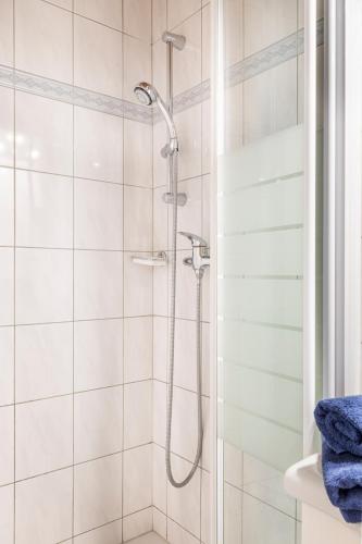 a shower with a shower head in a bathroom at Hallmoosgut in Sankt Johann im Pongau
