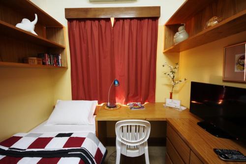 TV a/nebo společenská místnost v ubytování OKE Apart Hotel