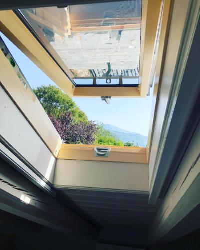 a skylight in a house with a window at KATIKIA ZAGORI in Vitsa