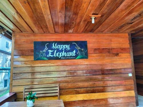 a sign on the wall of a restaurant at Happy Elephant Bungalows in Koh Rong Island