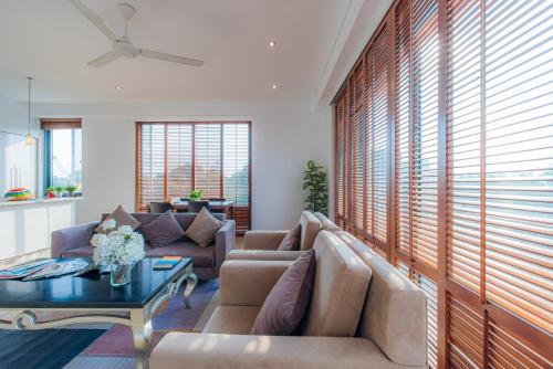 a living room with a couch and a table at Park view Avalon Apartment District 1 HCM City in Ho Chi Minh City