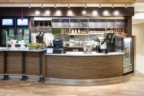 a bar in a restaurant with a counter at Fairfield Inn and Suites Phoenix Chandler Fashion Center in Chandler