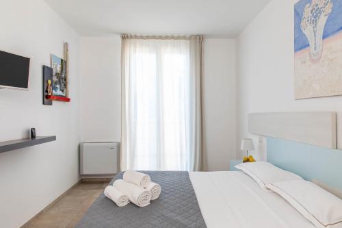 Postel nebo postele na pokoji v ubytování Palazzo Novecento