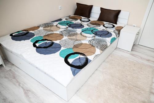 a bed with glasses on it in a bedroom at БИСЕР 2023 in Ruse
