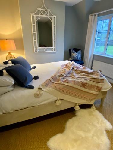 a bedroom with a bed with a rug on the floor at Ribblesdale Park in Gisburn