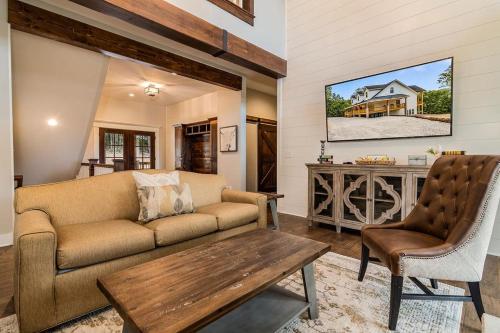 a living room with a couch and a table at Cedarwood Farmstead in Ridgedale
