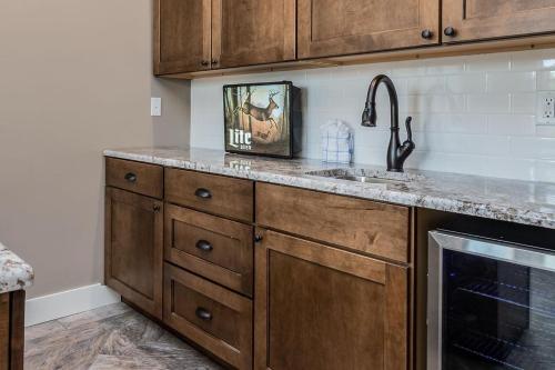 a kitchen with a sink and a counter top at Cedarwood Farmstead in Ridgedale