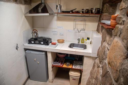 Una cocina o zona de cocina en Tinku
