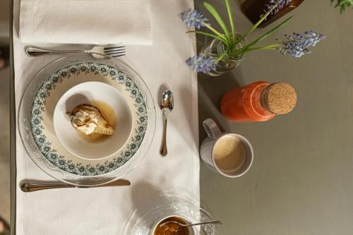 a table with a bowl of food and a cup of coffee at Casa Perazzolo in Montecchia di Crosara