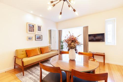 a living room with a table and a couch at Avenida Residence in Braga