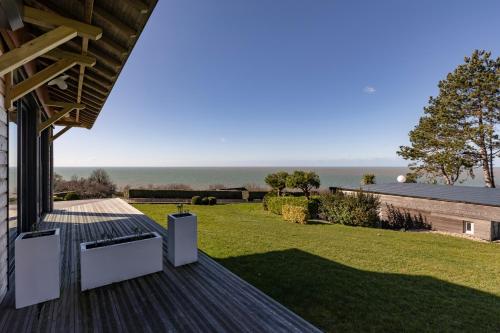a view of the ocean from the deck of a house at Domaine du Grand Bec in Villerville