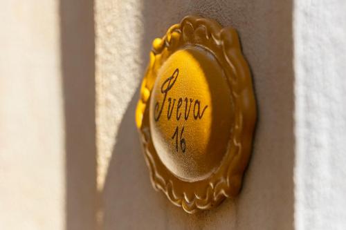 a yellow mitt on a wall with the word autism written on it at Residenza Sveva in Termoli