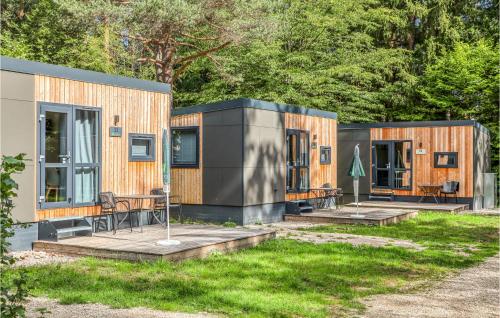 a couple of modular homes in a yard at Tiny Haus 17 Am Brombachsee in Pleinfeld