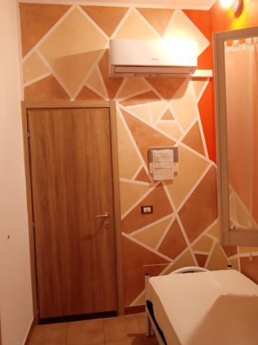 a room with a wall decorated with geometric tiles at Bed and Breakfast Stefania in Giulianova