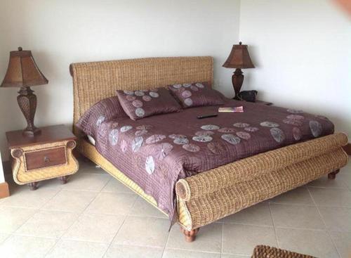 a bedroom with a large bed and two lamps at Bay view grand residencial - 3 beds-501 in Ixtapa