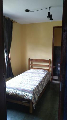 a bedroom with a bed in a room at Quinta da Bela Vista in Caeté