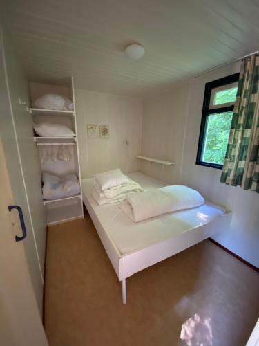 Llit o llits en una habitació de Cottage Rosa
