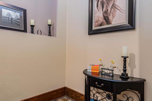 a room with a table with two candles on it at Ozark Outdoor Legacy in Ridgedale