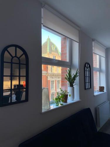 a room with a window with a view of a building at Central 2-bed Apartment in Dublin