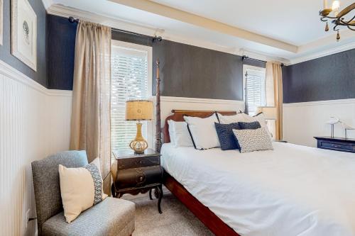 a bedroom with a bed and a chair at Millville by the Sea --- 39008 Seascape Ct in Millville