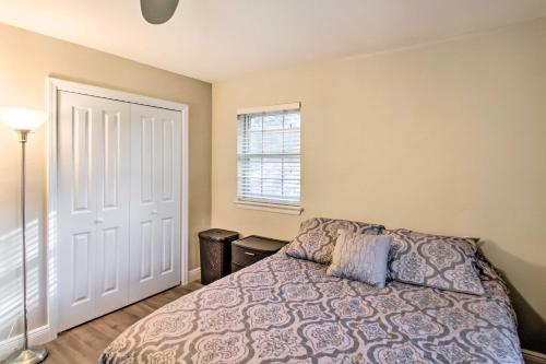 a bedroom with a bed and a window at Relaxing Pensacola Getaway with Volleyball Net! in Pensacola