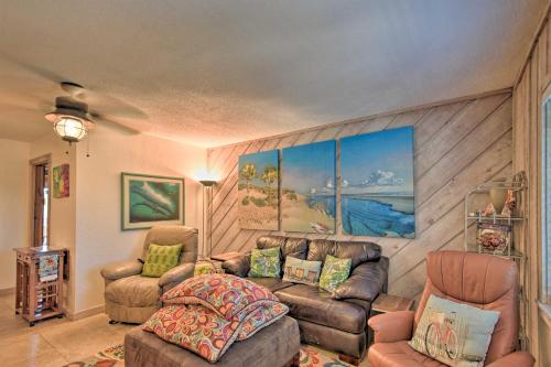 a living room with a couch and two chairs at NSB Townhome with Pool and Private Beach Access! in New Smyrna Beach