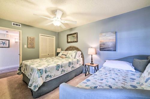 a bedroom with a bed and a ceiling fan at Bright and Breezy Condo, 2 Mi to Whitecap Beach! in Corpus Christi