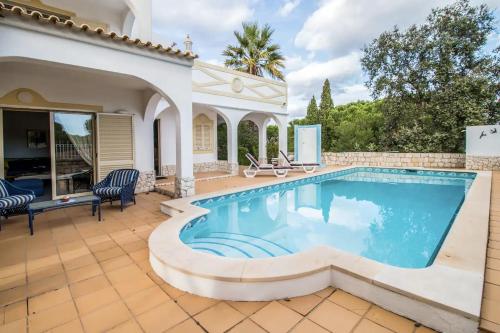 a pool in the backyard of a house at Falésia - Private Pool - 8 Guests - Albufeira in Albufeira