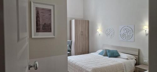 Postel nebo postele na pokoji v ubytování DIAZ Rooms